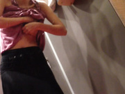 试衣间暗藏摄像头偷拍黑丝长裙女神换衣服还臭美拿手机自拍两张